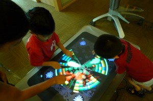 Kids playing with Surface table